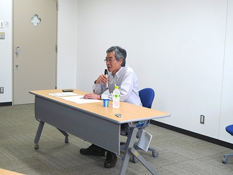 【写真1】野口 裕二氏の報告の様子